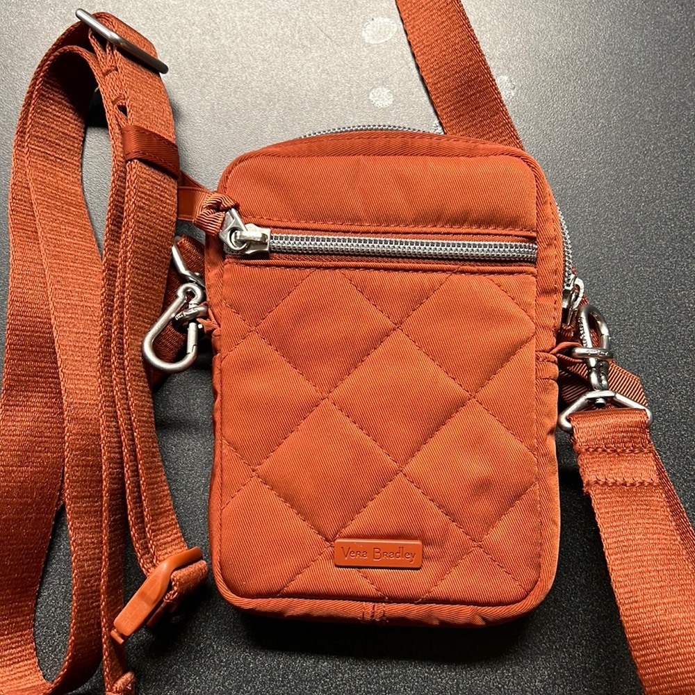 Small burnt orange crossbody bag with extra strap to make it a Fanny pack
